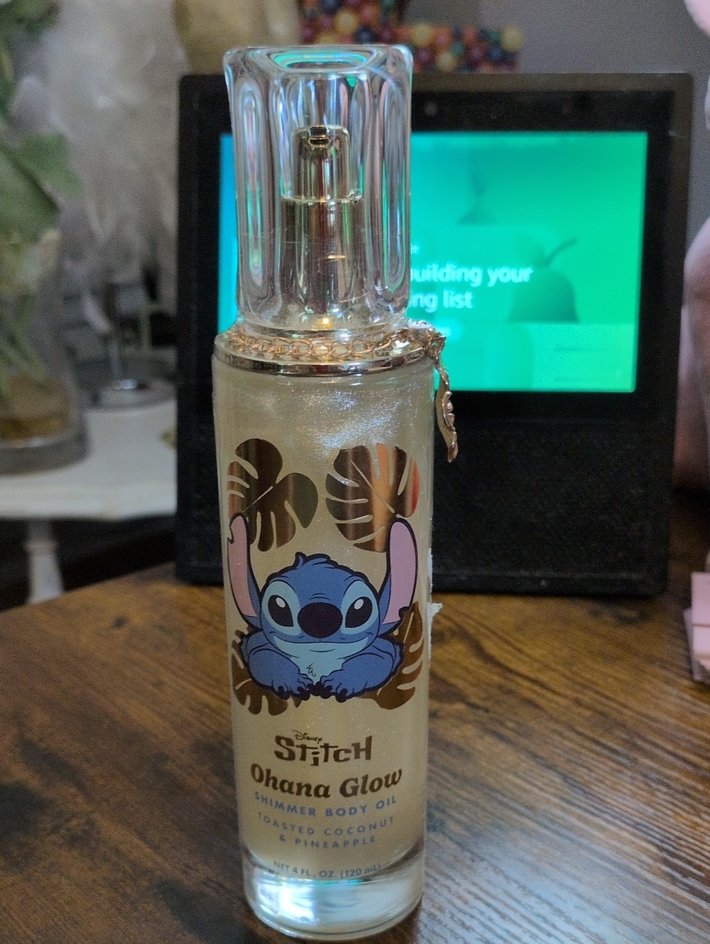Disney STITCH  Gold Shimmer Body Oil Bottle with Blue Stitch Graphic